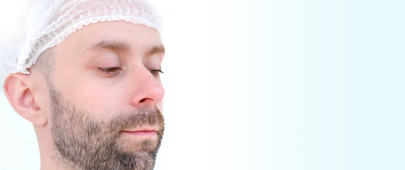 Obraz premium close-up bearded young male face, doctor, beautician, cosmetologist examines wrinkles, skin condition, patient preparation for surgery, aesthetic injection cosmetology, care anti-aging