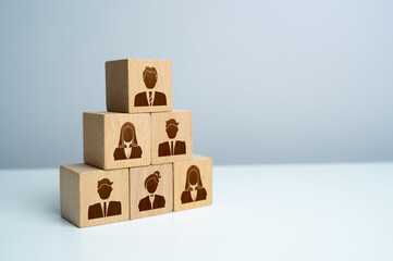 Pyramid of blocks with workers. Putting people in their places. Assemble a team of employees. How...