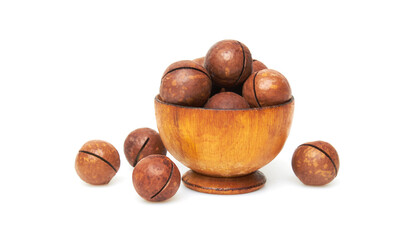 Macadamia nuts in bowl on a white