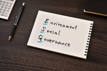 There is notebook with the word ESG. It is as an eye-catching image.