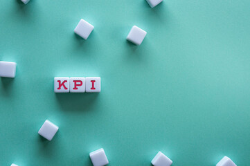 There is white cube with the word KPI. It is as an eye-catching image.