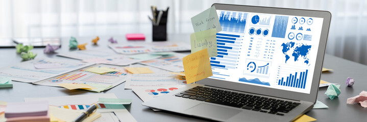 Sticky note for creative and analytic brainstorm for business idea with BI data dashboard on laptop screen. Analysis financial data visualization tech for marketing strategy. Prodigy