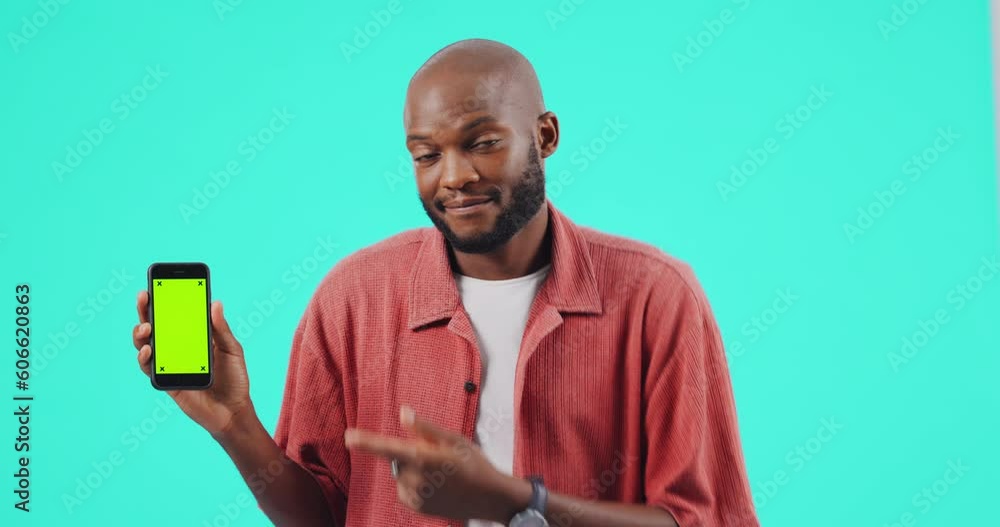 Poster Man, phone and pointing finger at mockup or green screen for bad review on website. Confused black person with smartphone tracking markers in studio for app ux, poor network or internet problem