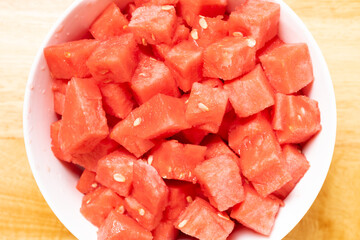 top view diced of fresh watermelon in a bowl at horizontal composition