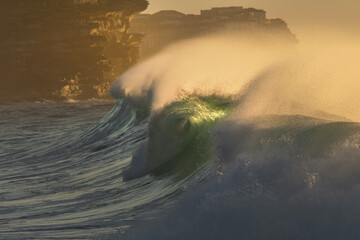 Large breaking wave at sunrise, Australia