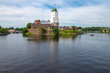 Fototapeta na wymiar View of the ancient Vyborg castle on a July morning. Vyborg, Russia