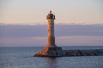 The old Finnish lighthouse Vuohensalo in april twilight. Motornaya Bay, Ladoga lake. Leningrad...