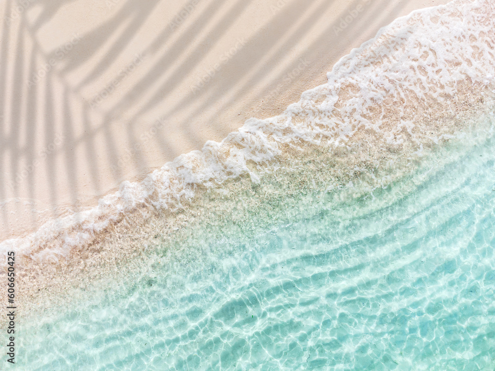 Wall mural aerial top view of beautiful tropical white sand beach with wave foam and transparent sea, summer va