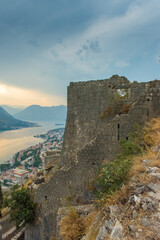 Fototapeta na wymiar Bay of Kotor, Montenegro. Kotor is beautiful medieval town on Adriatic Sea, with cruise boasts, Venetian fortress, old tiny villages, and mountains