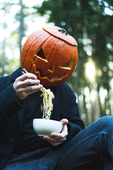 person with pumpkin