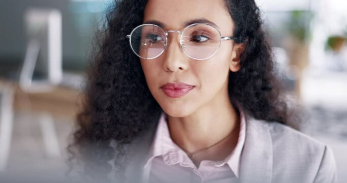 Business woman, online research and computer in data analytics, editing or reading digital report in office workspace. Satisfied, focus and biracial person or editor working, desktop and tech company