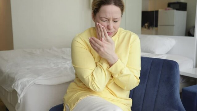 tooth pain, toothache, diseases of the oral cavity, a woman with flux or caries suffers, suffers from pain