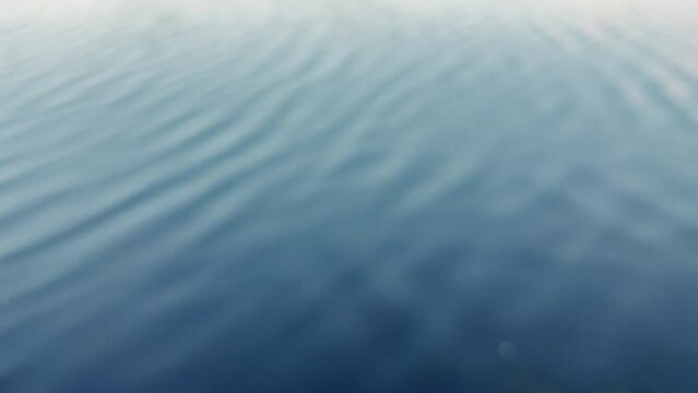 Blue ocean water surface ripple background. 