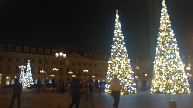 Glowing Giant Christmas Trees At Place Vendôme In The 1st Arrondissement of Paris, France. Defocused