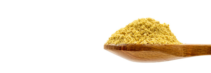 Ginger powder isolated on white background. Ginger powder in wooden spoon