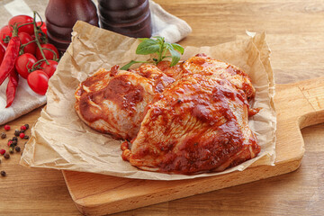 Marinated chicken leg in tomato sauce