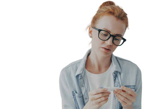 Upset sick young woman having high fever in morning, holding thermometer while sitting on bed - Powered by Adobe