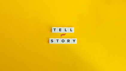 Tell Your Story Phrase. Branding, Selling Strategy, Brand Awareness, and Marketing Concept. Block Letter Tiles on Yellow Background. Minimal Aesthetic. - obrazy, fototapety, plakaty