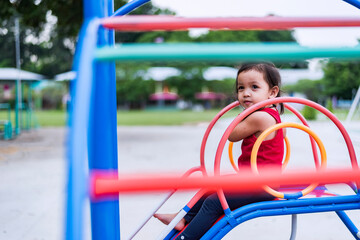 Kids playing on outdoor playground, kids playing in school or kindergarten, kids active on colorful slides and swings, healthy summer activities for kids.