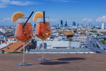 Wandcirkels tuinposter Two Spritz cocktails on a table with view of Milan, Italy © Maria Vonotna