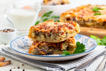 Pie with wild mushrooms, potatoes and cheese.