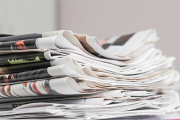 Pile of old newspapers, selective focus. Copy space