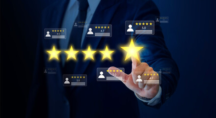 Businessman pointing five star symbol to increase company rating.