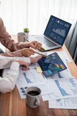 Analyst team colleague discuss financial data on digital dashboard, analyzing charts graph display...