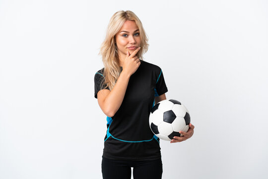 Young Russian woman playing football isolated on white background thinking