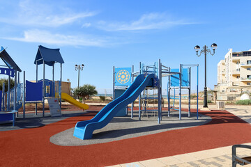 View of children's playground with slide at sea resort
