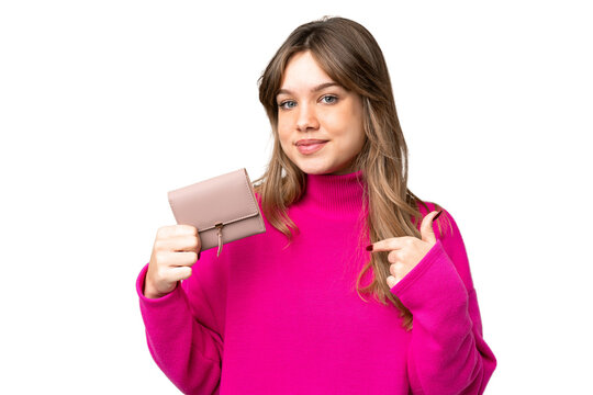 Young girl holding a wallet over isolated chroma key background with surprise facial expression