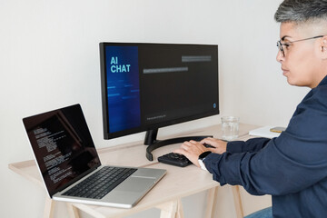 Fototapeta na wymiar AI chatbot: Programmer using artificial intelligence for software development inside office - Virtual chat Bot technology trend - Focus on hands