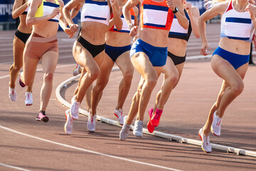 group women runners athletes running 800 metres in summer athletics championships