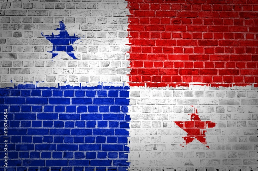 Sticker shot of the panama flag painted on a brick wall in an urban location