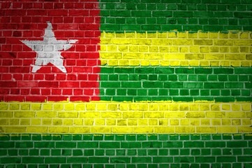 Shot of the Togo flag painted on a brick wall in an urban location