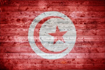 Illustrative flag of Tunisia on a wooden surface