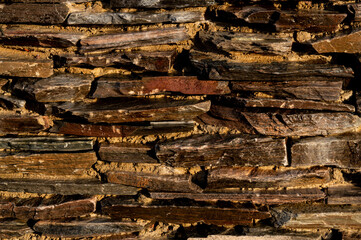 old stone texture in wood colors with a sun ligh