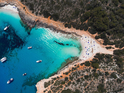 Beautiful drone view of the beach Cala Varques with boats on Mallorca