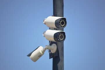 security camera on a blue sky