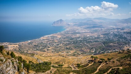 Aerial view of a village on the edge of a cliff near the ocean