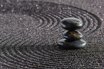 Japanese Zen garden with stone in textured sand