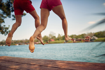 jumping from a pier into the water