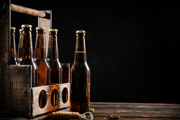 Beer bottles in an old box. - Powered by Adobe
