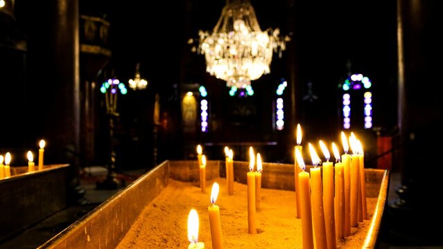 Selective focus shot of Candles in a Coptic church, Cairo, Egypt