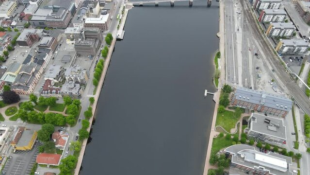 Drone view over the river at Drammen in Viken, Norway - slow motion