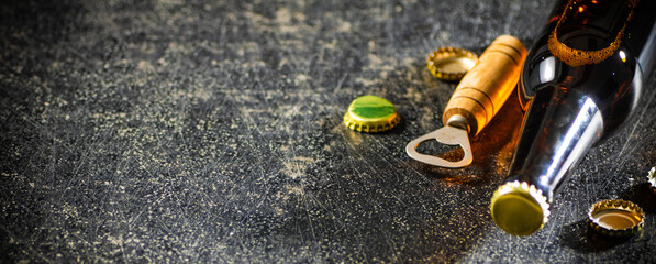 Beer in glasses and bottle opener.