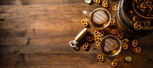 Beer in glasses with salted pretzels.
