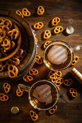Beer in glasses with salted pretzels.