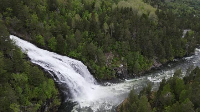Drone view over the giant waterfall in Geiranger fjord, Norway - slow motion