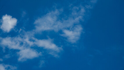 Naklejka na ściany i meble Blue sky and white clouds on a sunny day